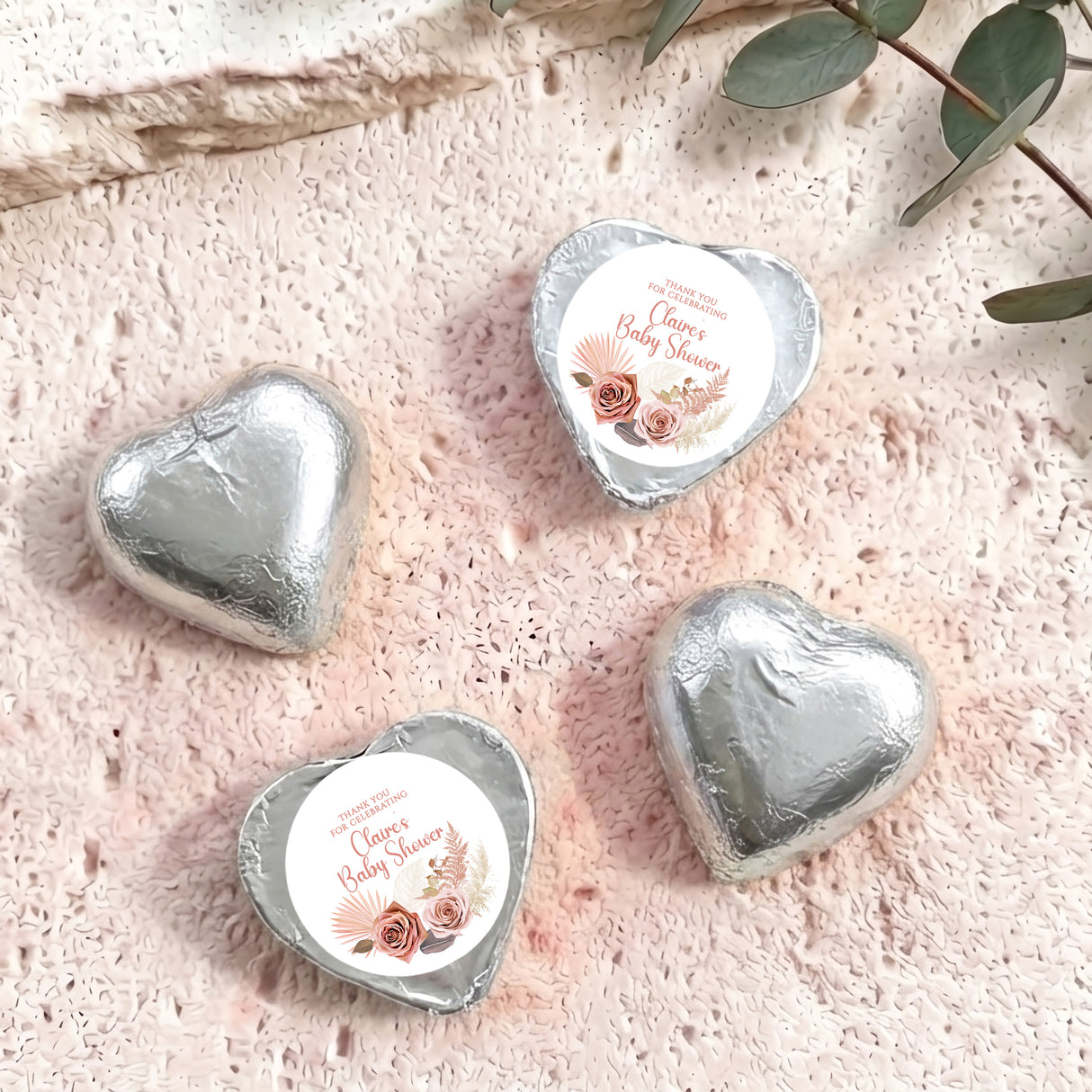 Silver foil heart chocolates with “Baby Shower” label and rose floral design