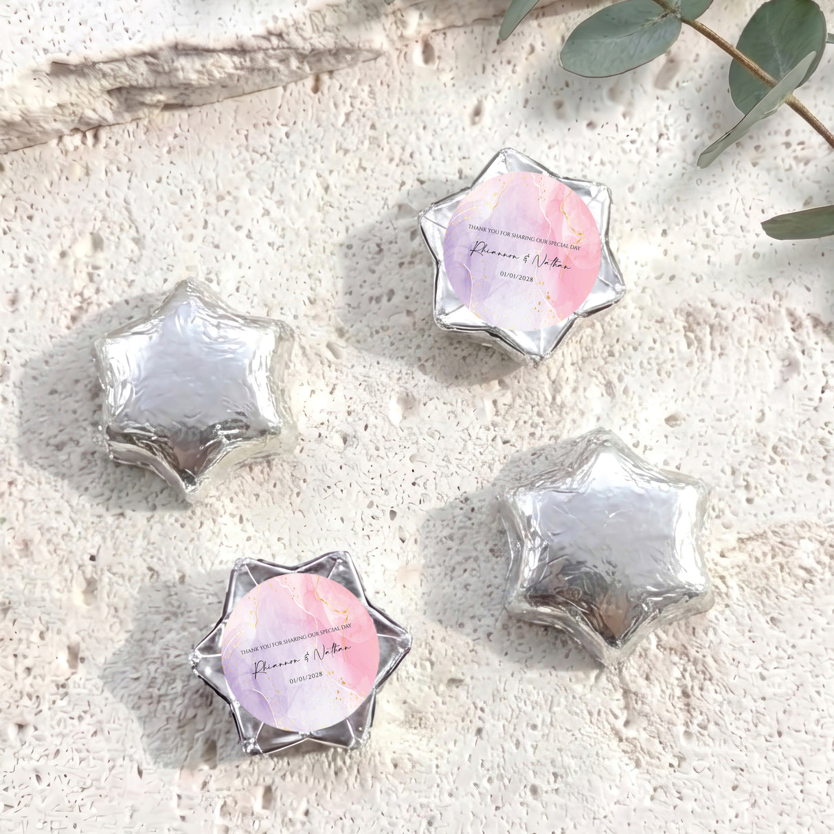 Personalised foil-wrapped chocolate star chocolates in silver, four star shapes