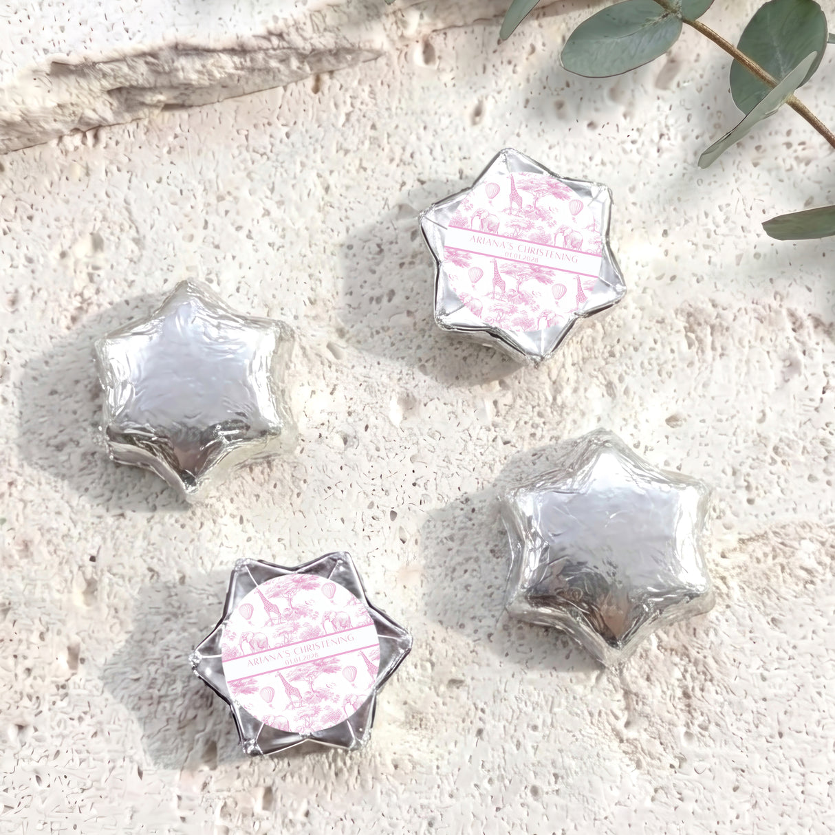 Silver foil-covered chocolate stars with personalized white center foil