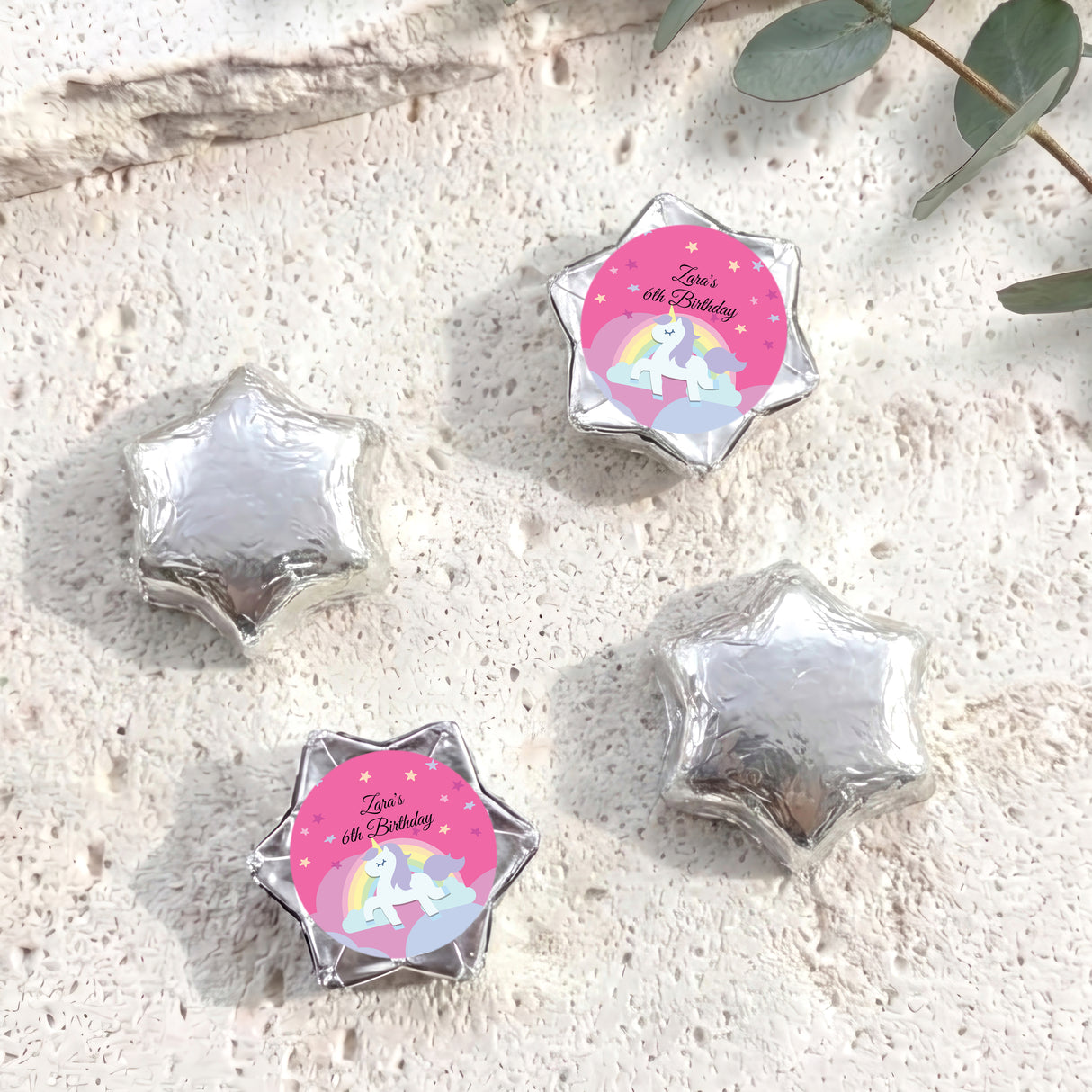 Silver star-shaped foil chocolate with “Zara’s 6th Birthday” unicorn rainbow label