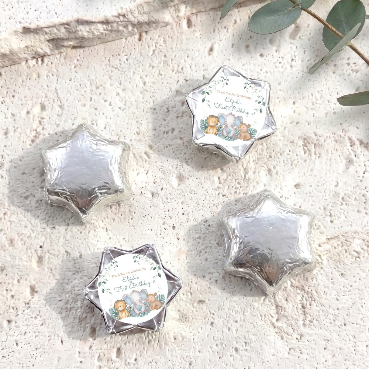 Silver foil-covered chocolate star gift with baby-themed personalised label