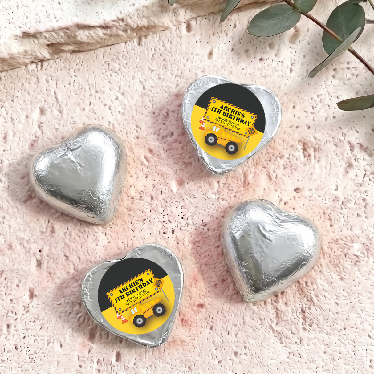 Silver foil chocolate heart with 'Archie's 4th Birthday' label