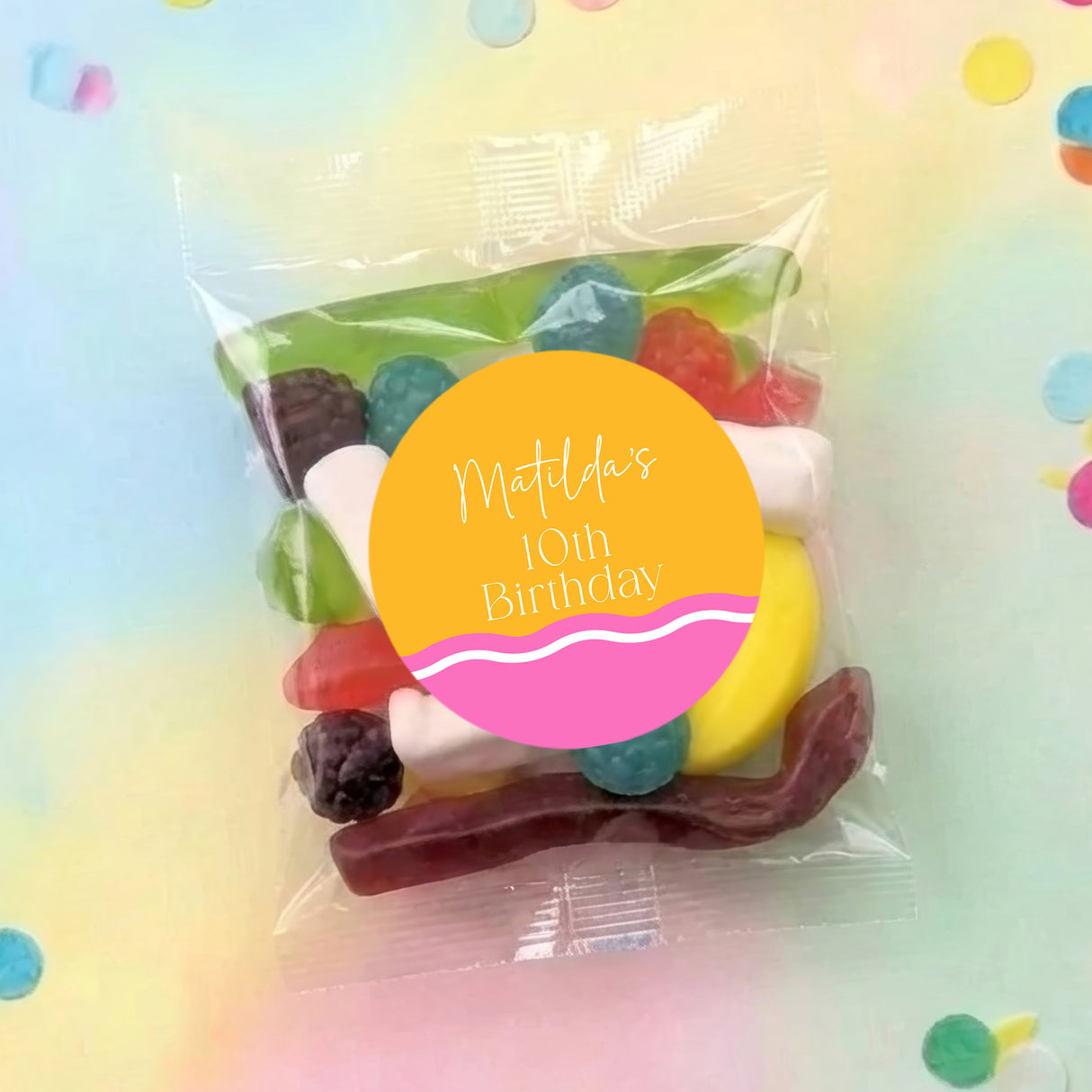 Personalised party lolly bag with clear wrap and colorful candy, round birthday label