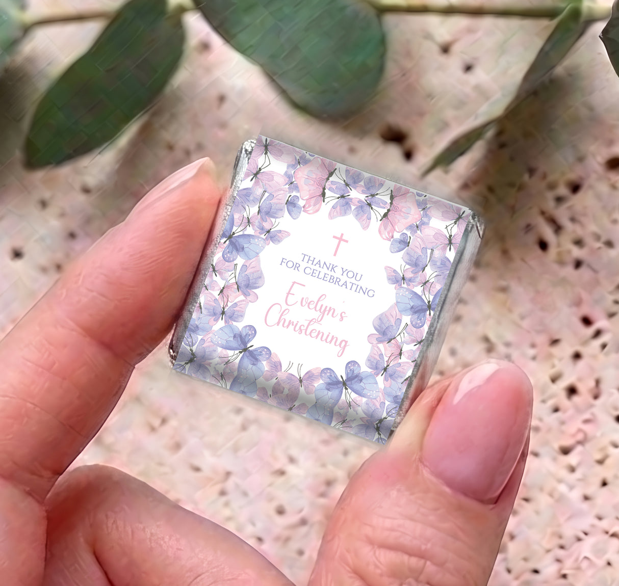 Mini chocolate wrapper with butterfly design and 'Thank you for celebrating' text