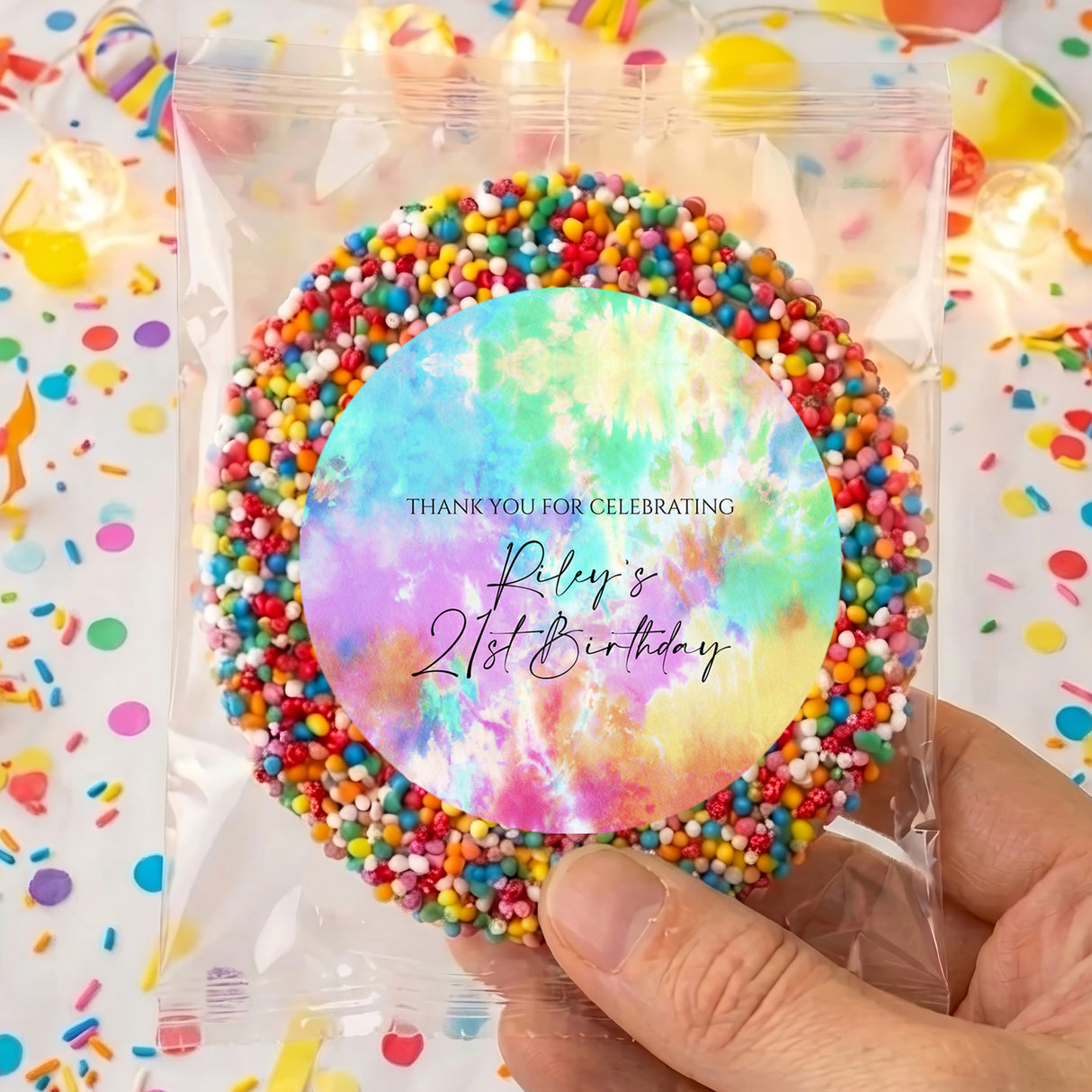 Personalised tie-dye birthday treat bag with multicolor sprinkle border and round label