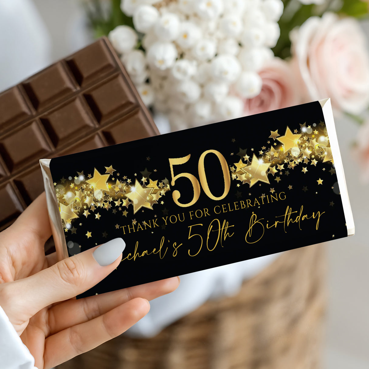 50th birthday chocolate bar wrapper, black with gold stars and 50 logo