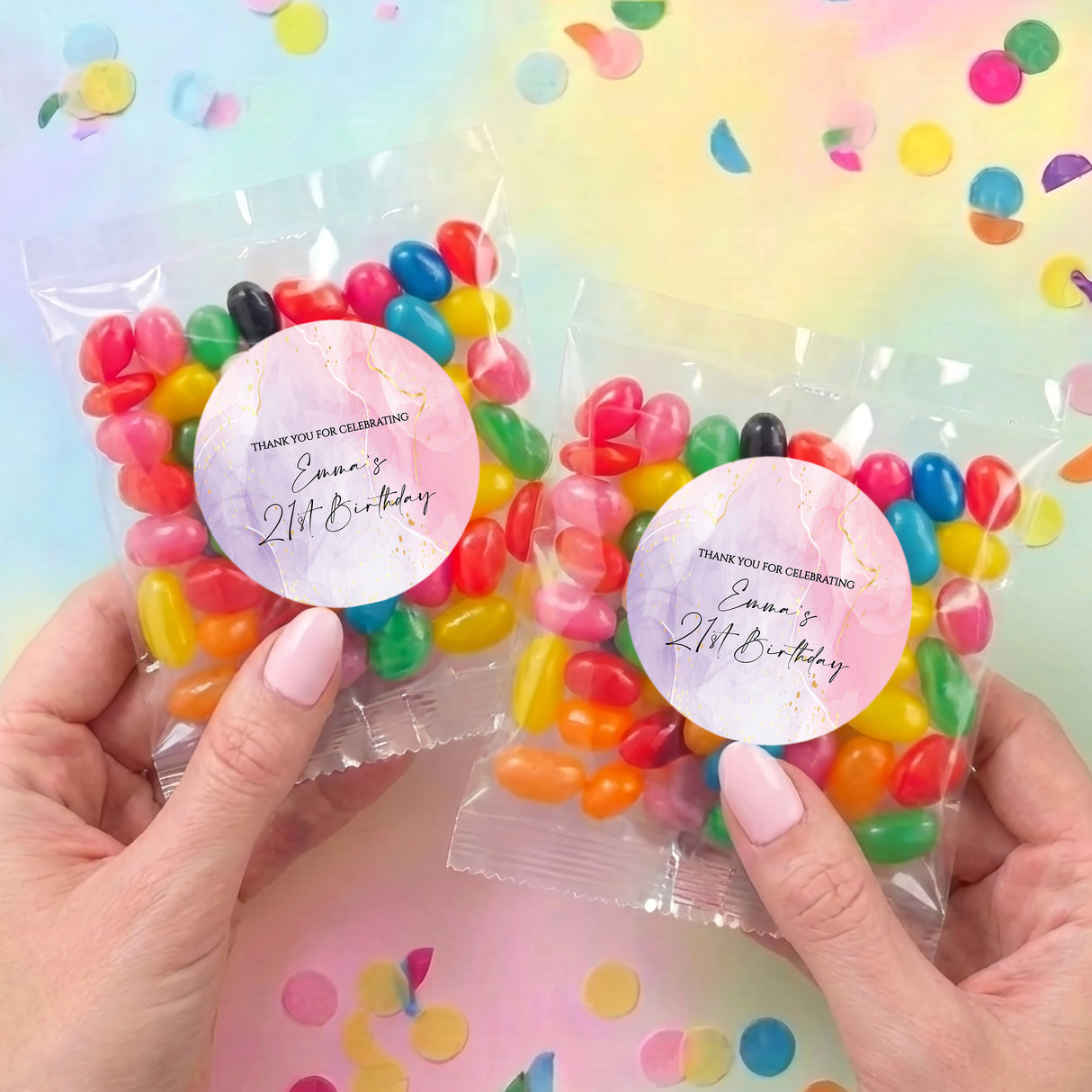Two personalised jelly bean bags held in hands, Emma’s 21st Birthday stickers, assorted beans