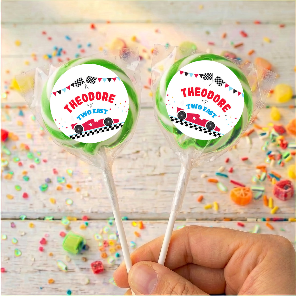 Personalised race car lollipops with green-striped wrapper and printed car labels