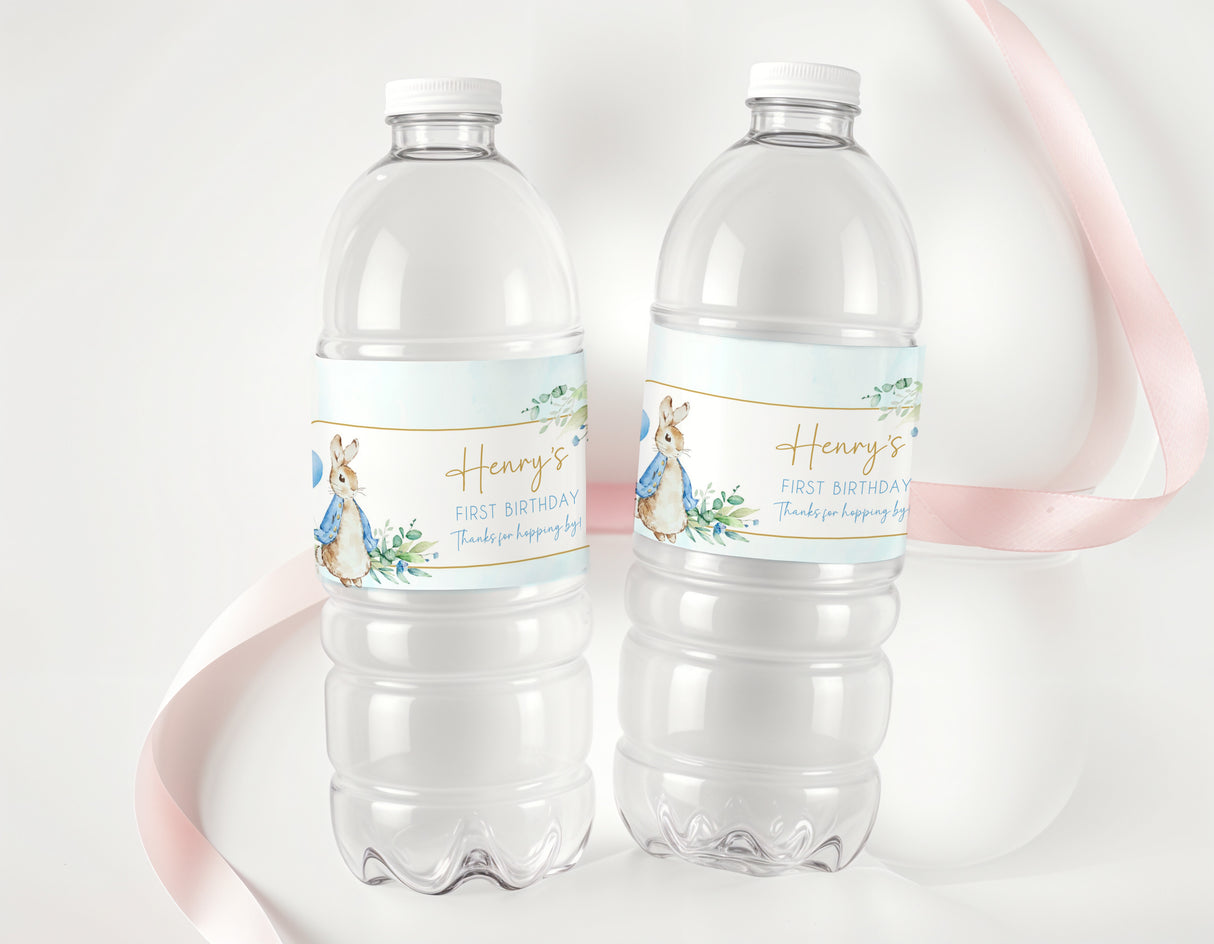 Clear plastic water bottles with light blue Peter Rabbit first birthday labels