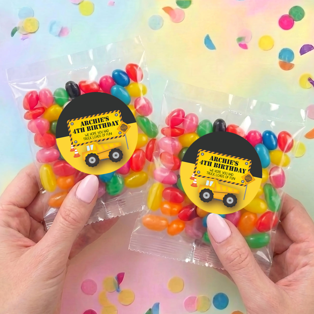 Two personalised jelly bean bags with mixed sweets and truck birthday labels