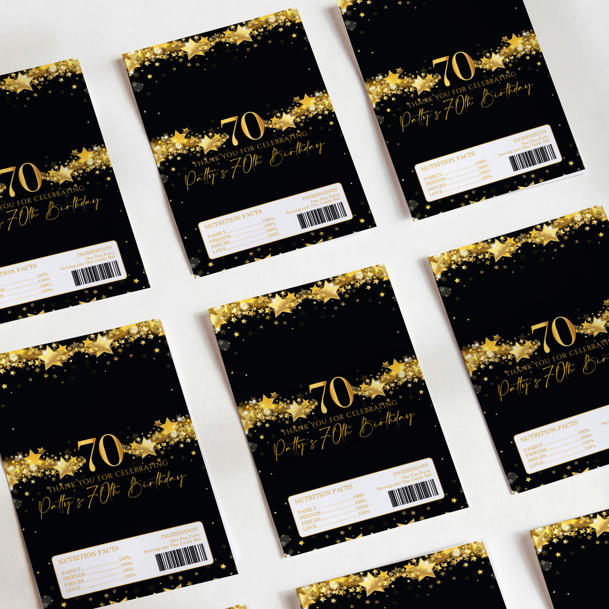 Black and gold 70th birthday chocolate wrappers, star print with '70' and label strip
