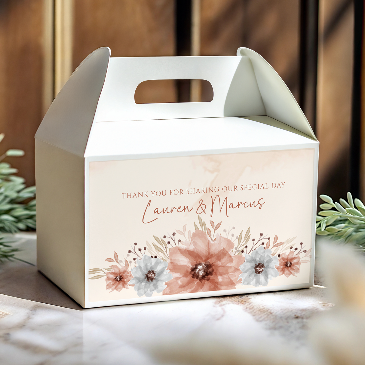White gable wedding favour box with handle cutout and watercolour florals, 'Lauren & Marcus'.