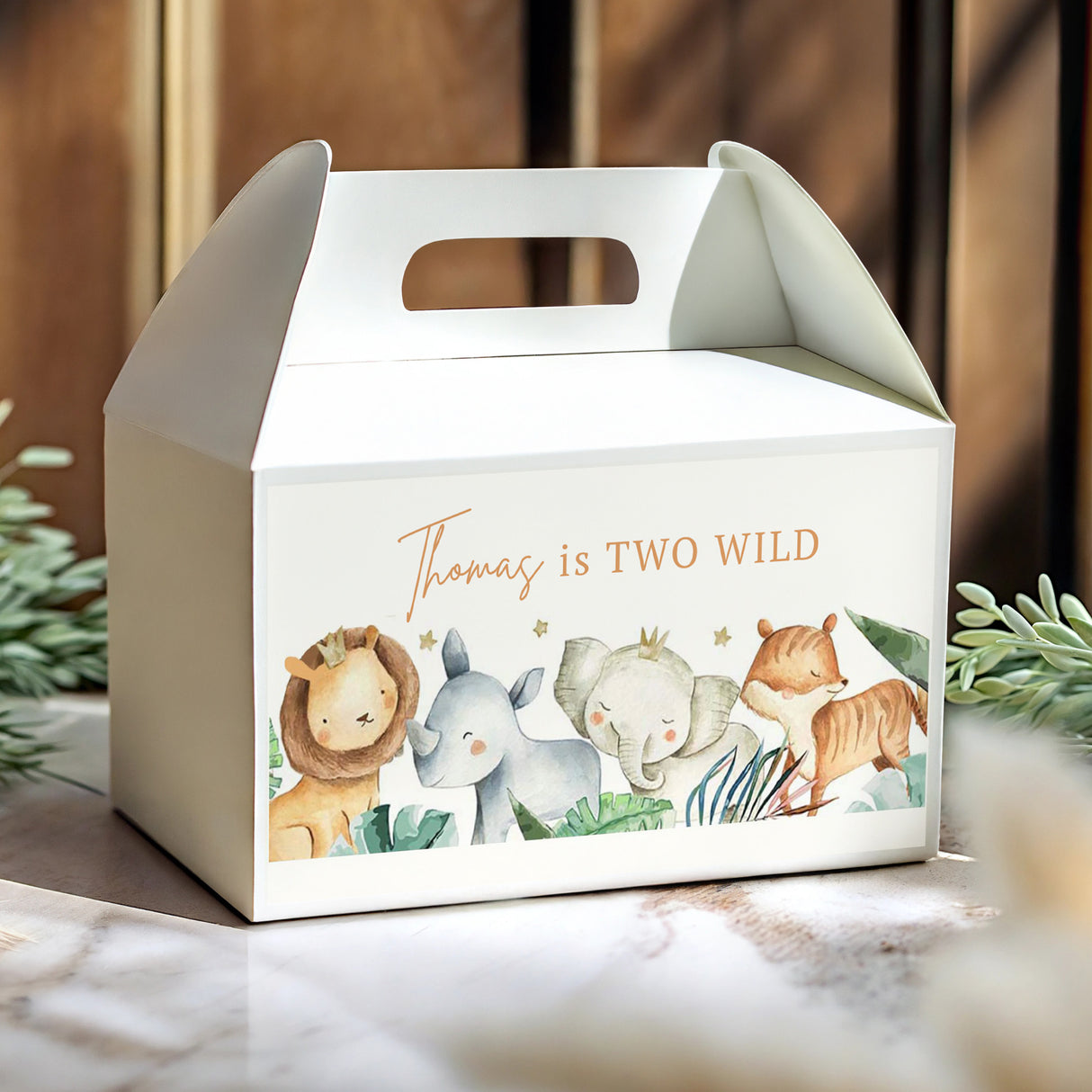 Personalised white gable favour box with jungle animal print and “Thomas is TWO WILD” text