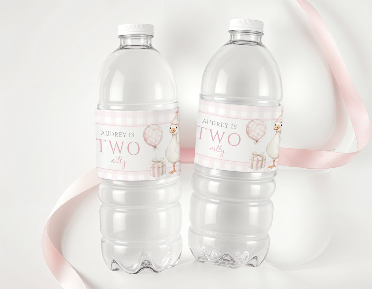 Clear plastic water bottles with pink personalised labels, names and balloon graphic