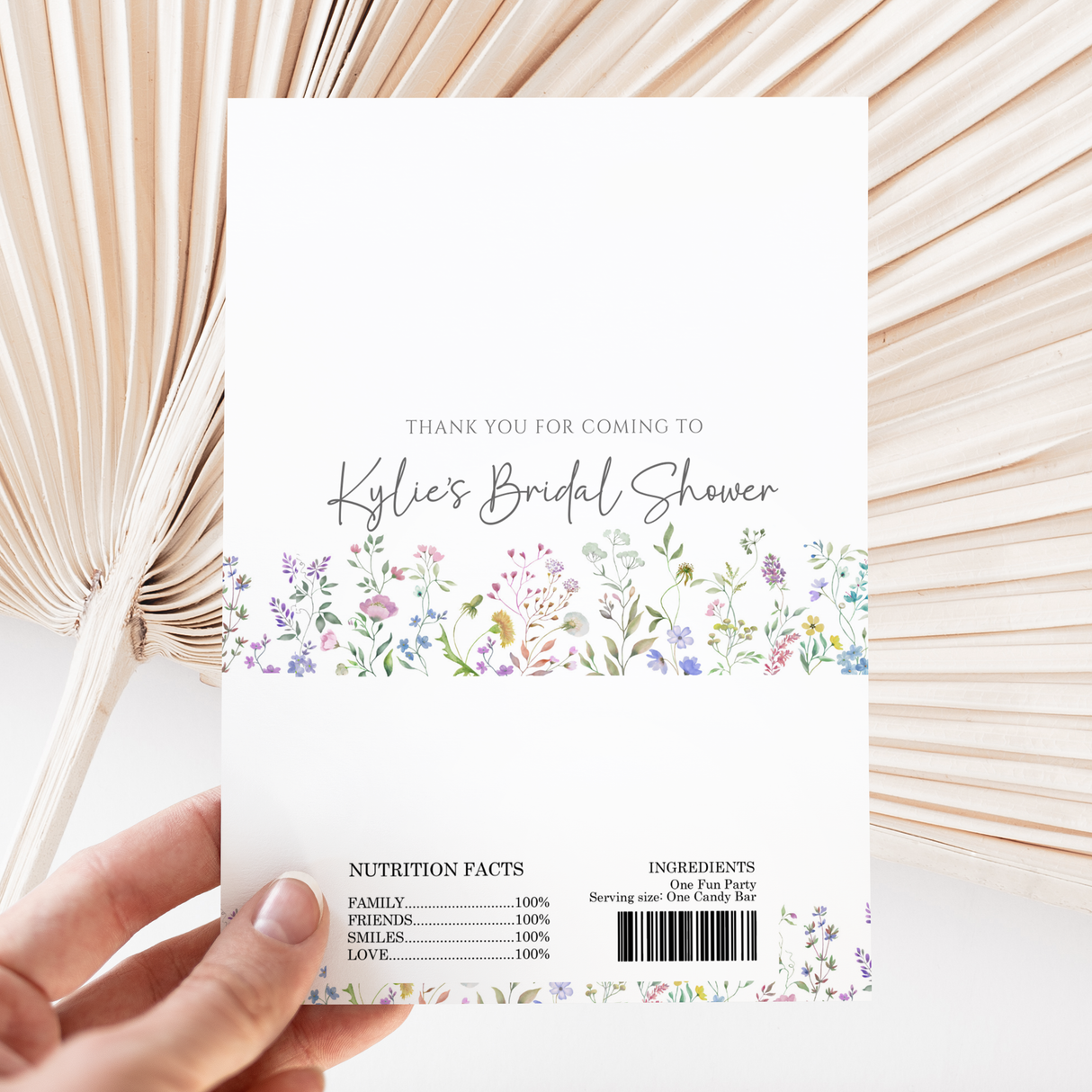 White printed chocolate wrapper with floral border, thank-you text and barcode