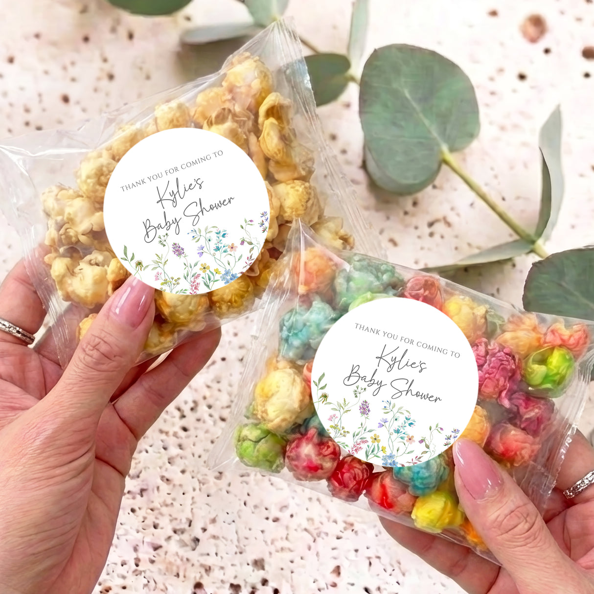 Personalised baby shower popcorn bag: clear sleeve, mixed popcorn, round wildflower label