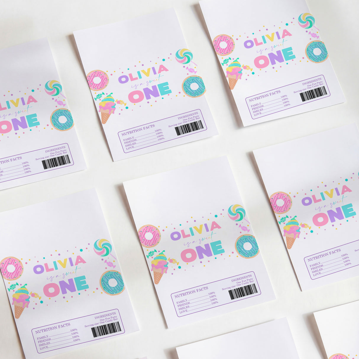 First birthday chocolate wrappers with colorful βOlivia Oneβ donut and sprinkles print