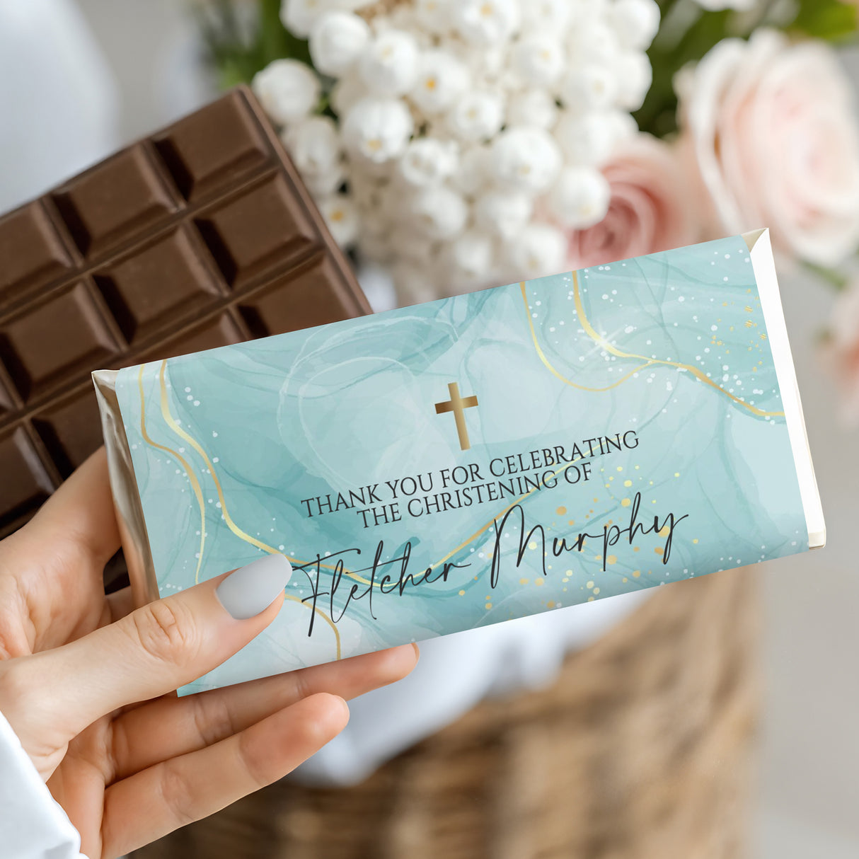 Turquoise christening chocolate bar wrapper with gold cross and 'Murphy' text
