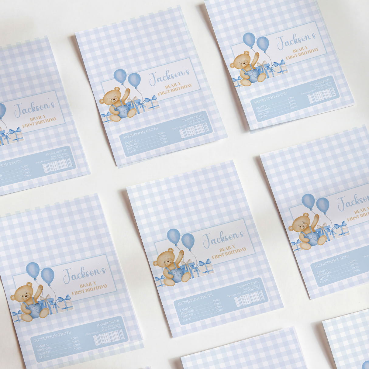 Blue gingham teddy bear chocolate wrappers with balloons, name, and price fields