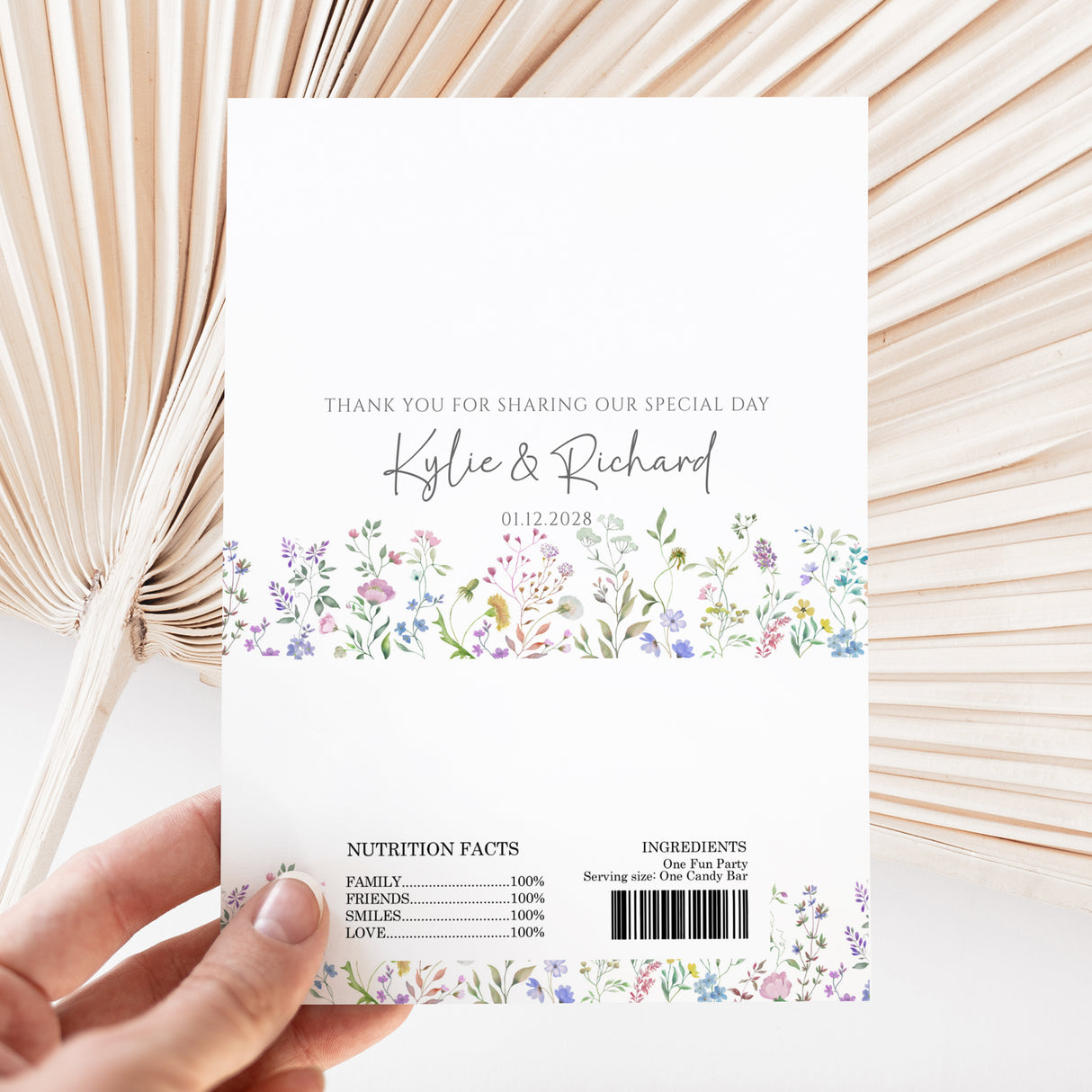 White chocolate wrapper with floral border, thank-you text, Kylie & Richard, date, barcode.