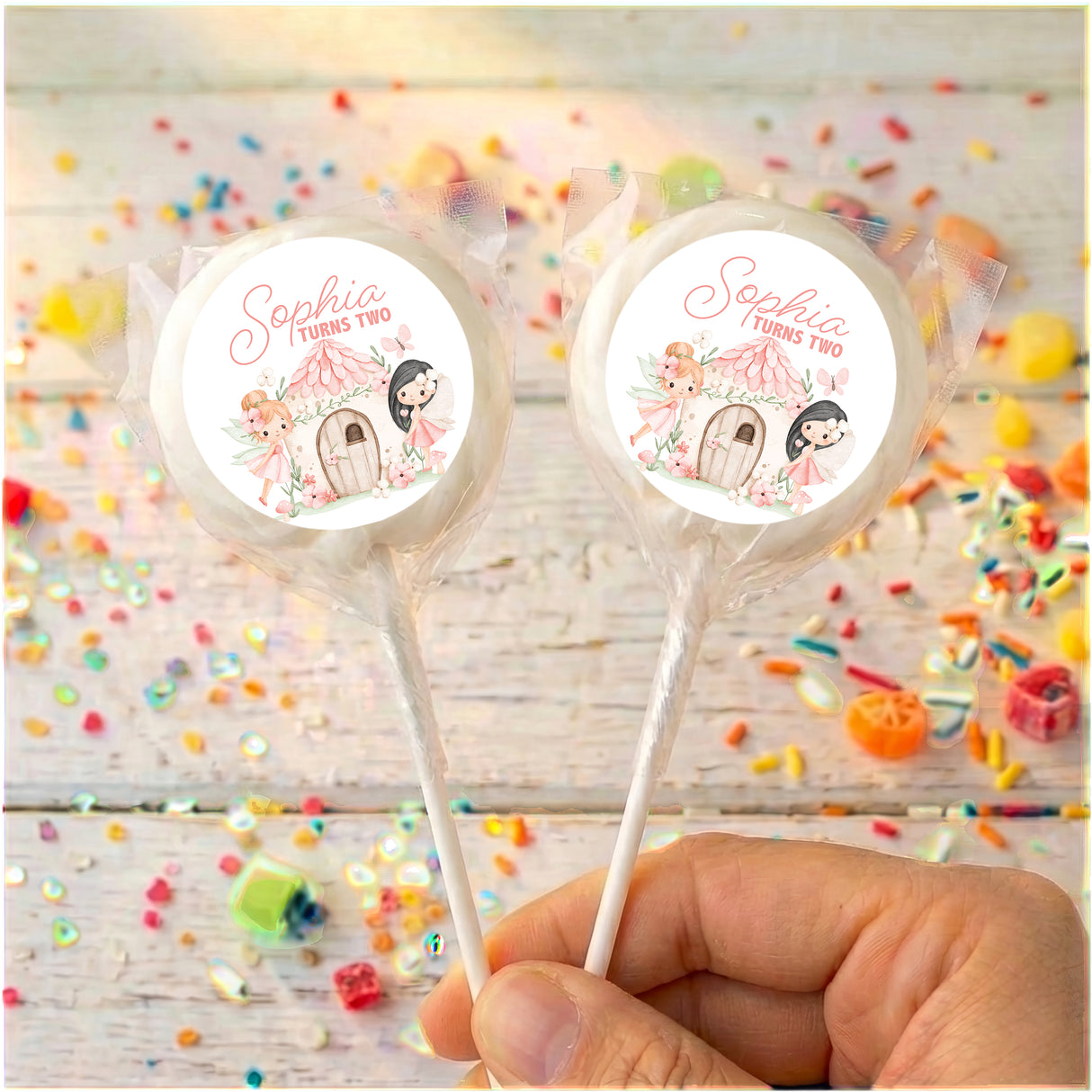 Personalised lollipops on sticks with round Sophia turns two labels, multi-color border