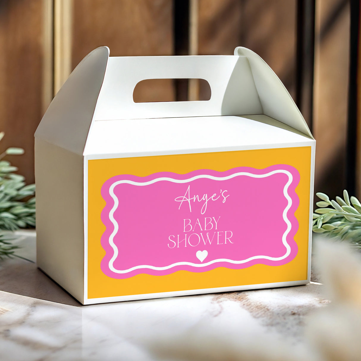 Yellow gable favour box with pink label, Baby Shower text and handle cutout