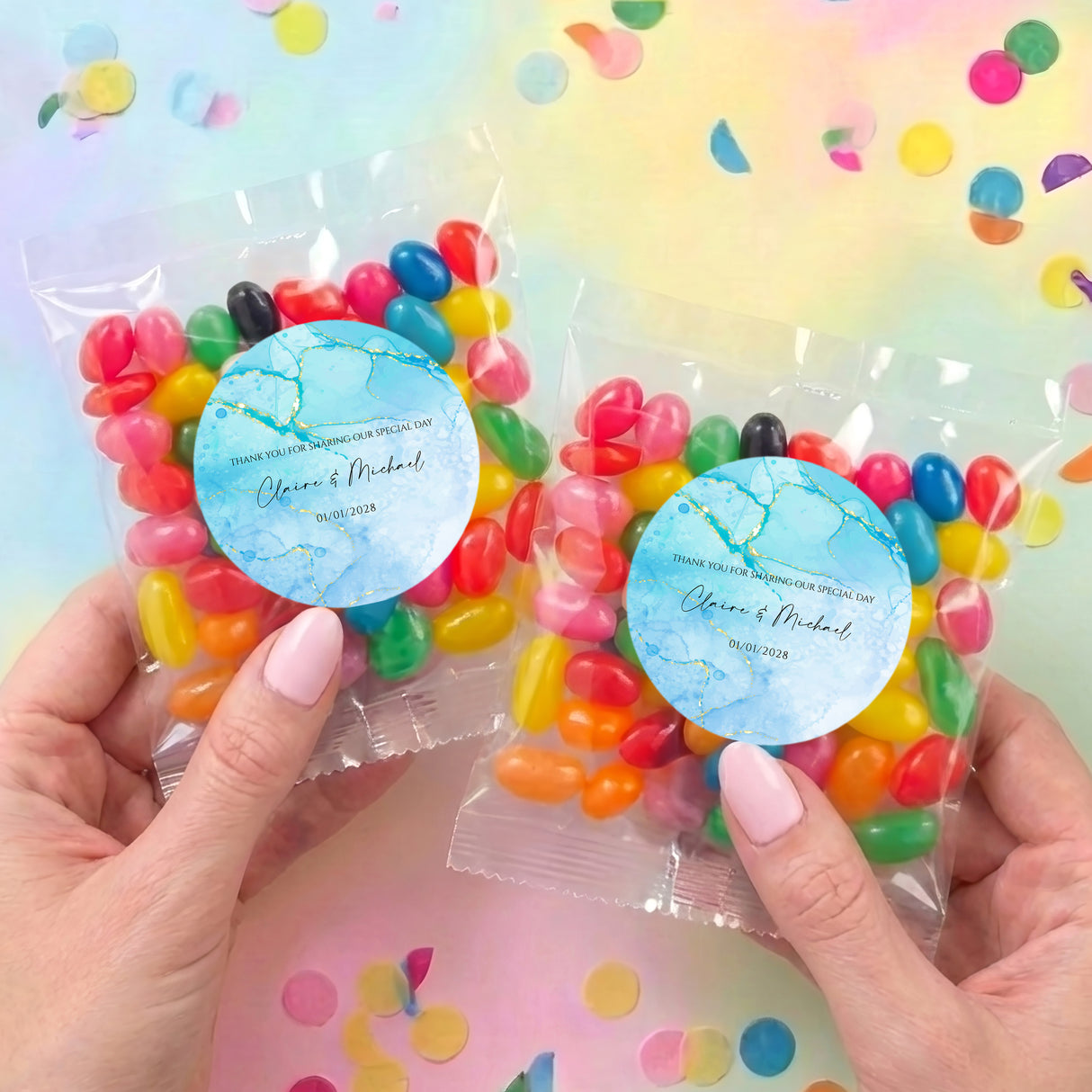 Two personalised jelly bean bags with blue marble round labels and mixed-color jelly beans