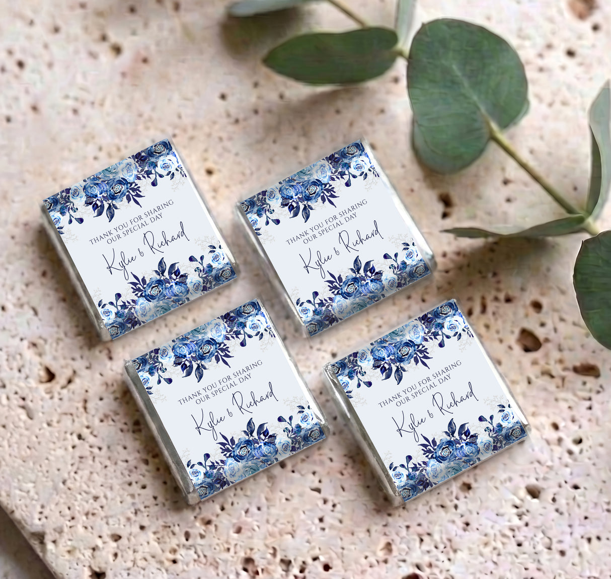 Set of personalised mini chocolates with blue floral thank you wrappers, four shown