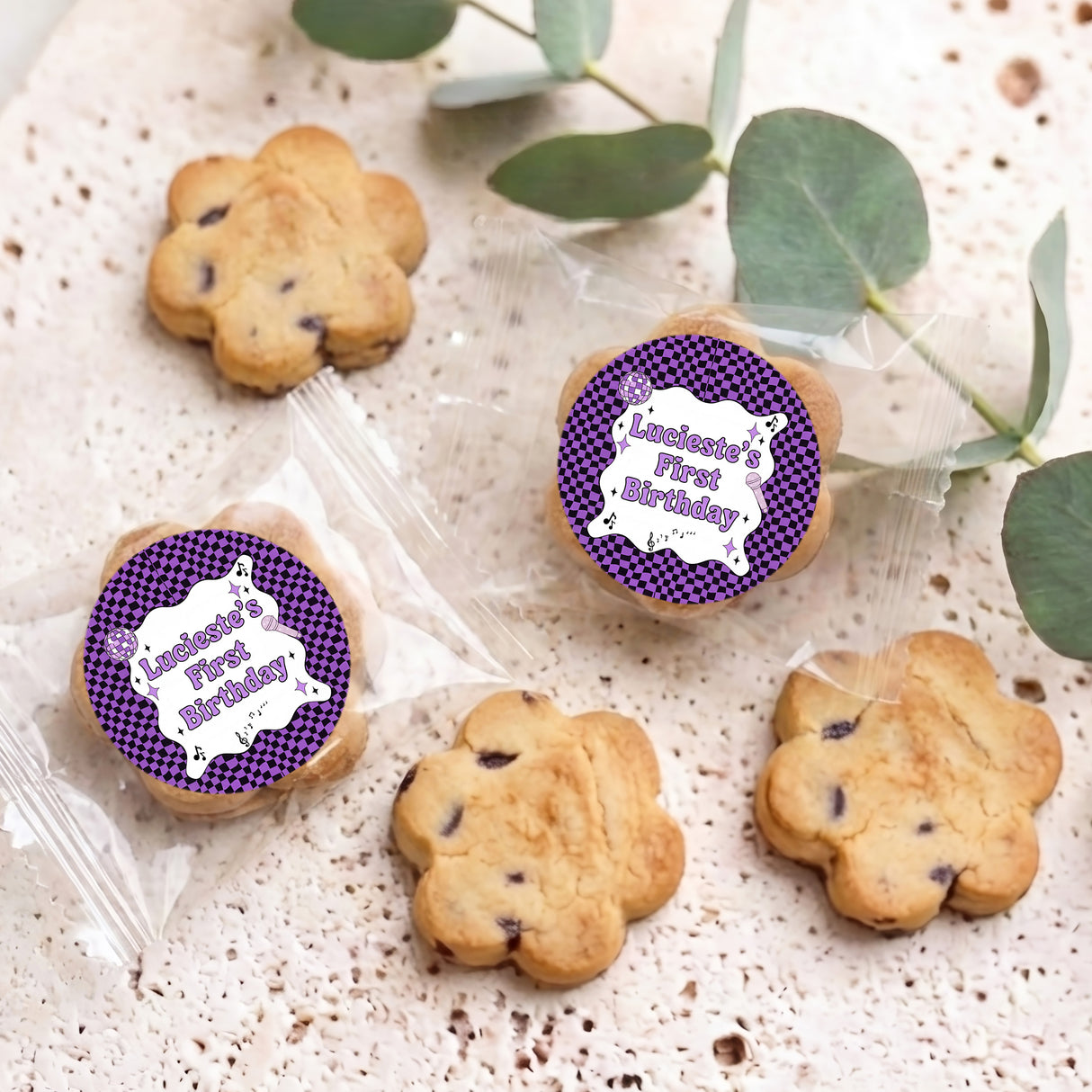 Personalised bite-size choc chip cookies with purple “Birthday” sticker tags