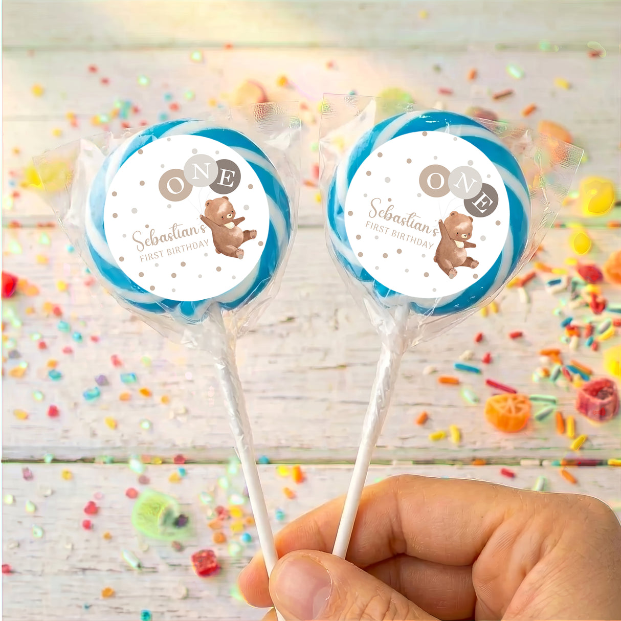 Personalised baby lollipops with blue-rim bear label on clear wrapped sticks