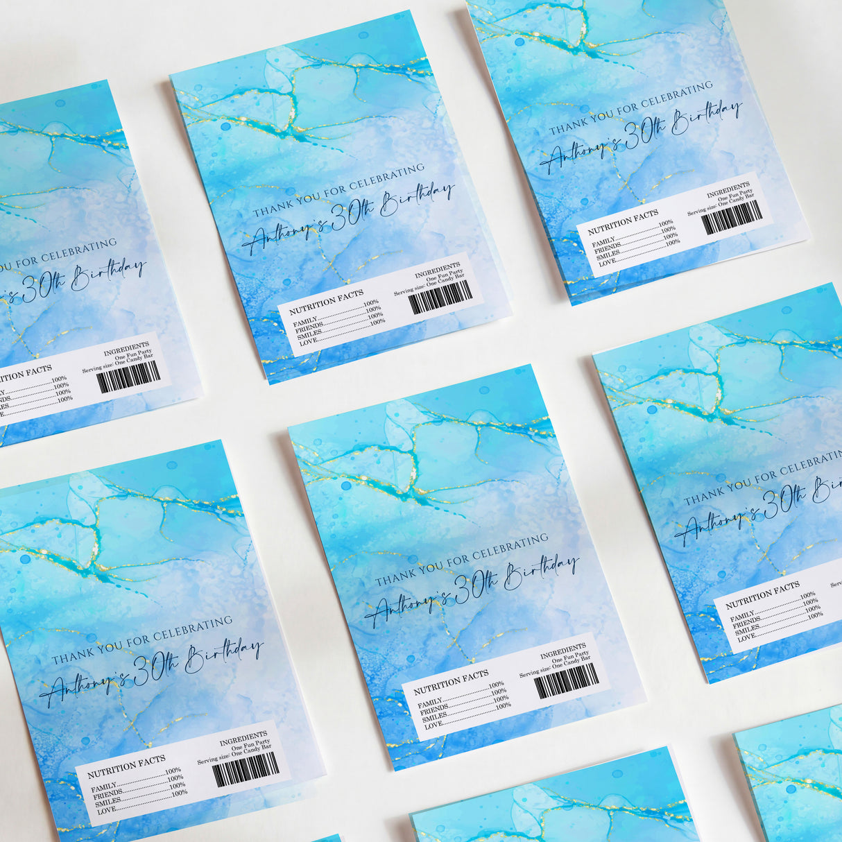 Blue 30th birthday chocolate wrappers with gold text and marbled accent lines