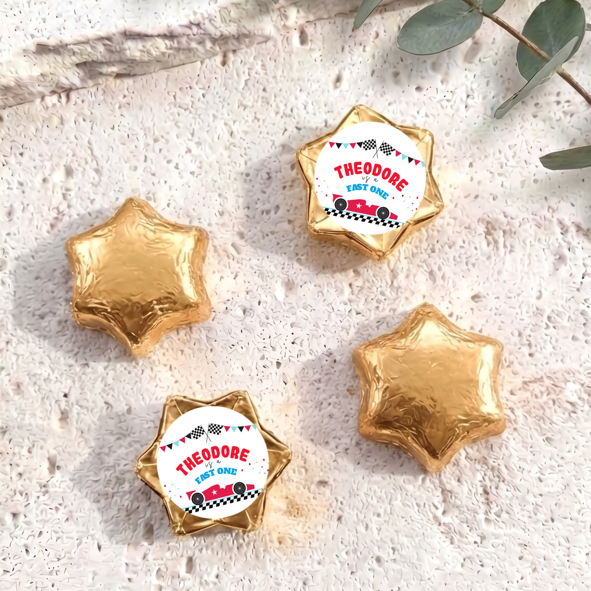 Personalised foil chocolate star set with gold foil and “THEODORE” label