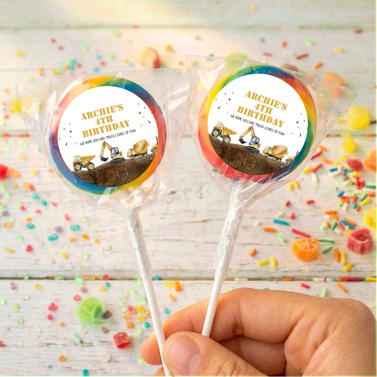 Personalised lollipops with ARCHIE'S BIRTHDAY truck labels, two multicolor-ring sticks