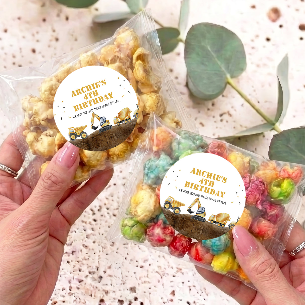 Personalised popcorn bags: 'Archie's 4th Birthday' circles with construction trucks