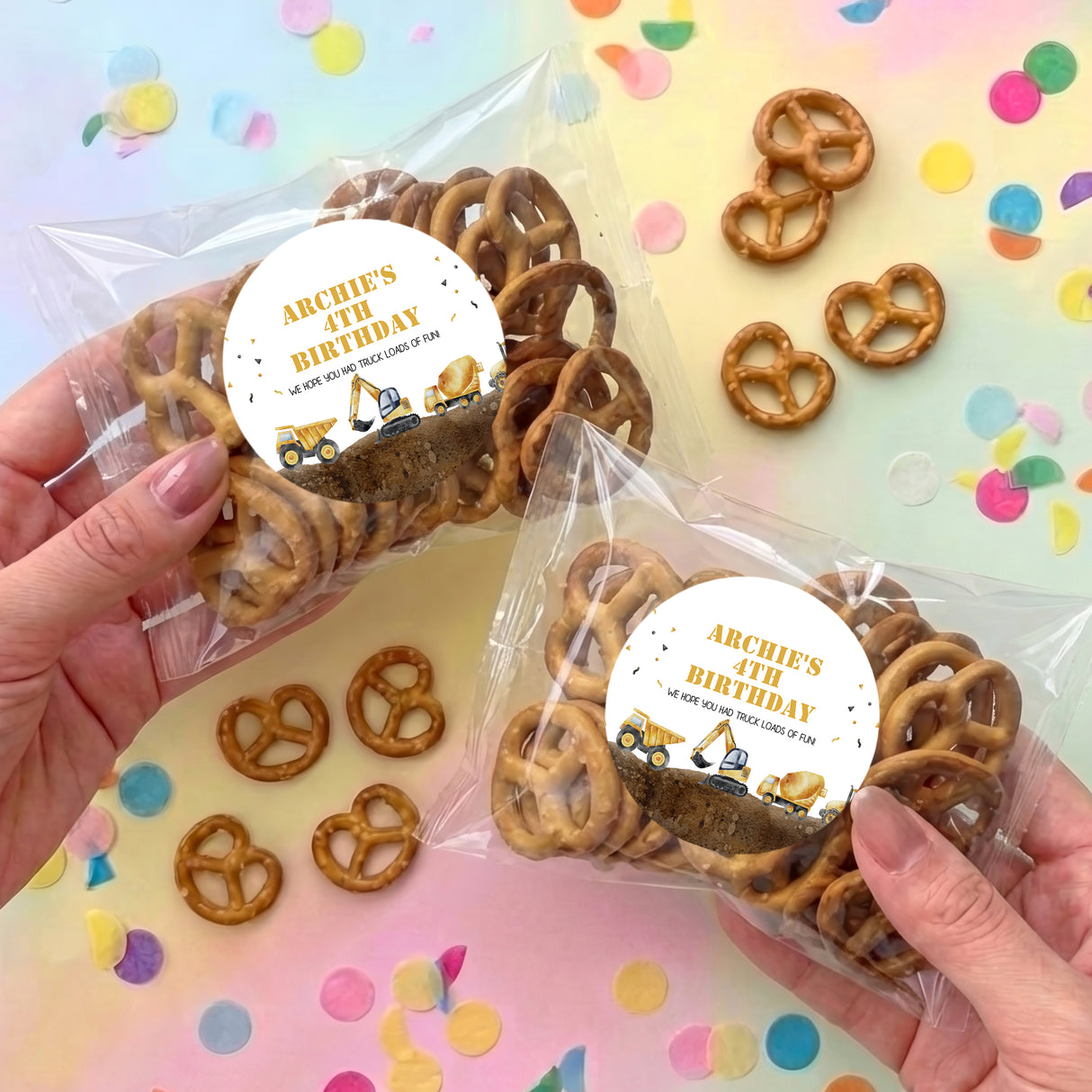 Personalised construction-themed pretzel bag with circular birthday label and pretzels