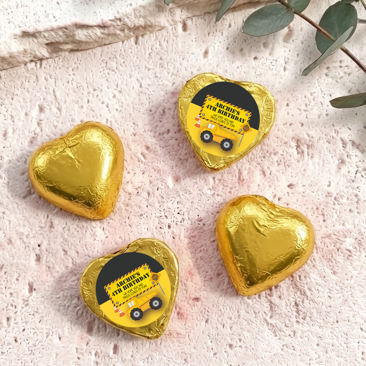 Gold foil chocolate heart with 'Archie's 4th Birthday' label