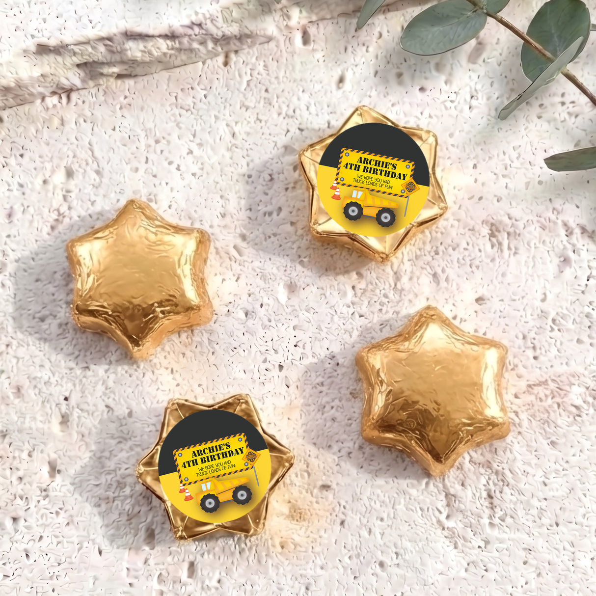 Personalised foil chocolate star with “Archie’s 4th Birthday” label, gold foil