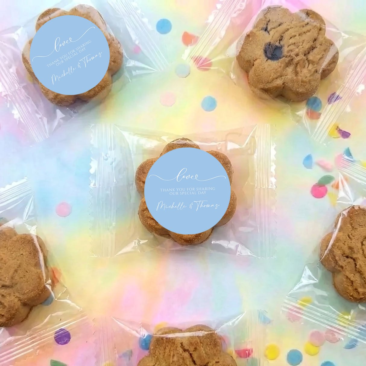 Clear plastic bag of bite-size chocolate chip cookies with round blue labels