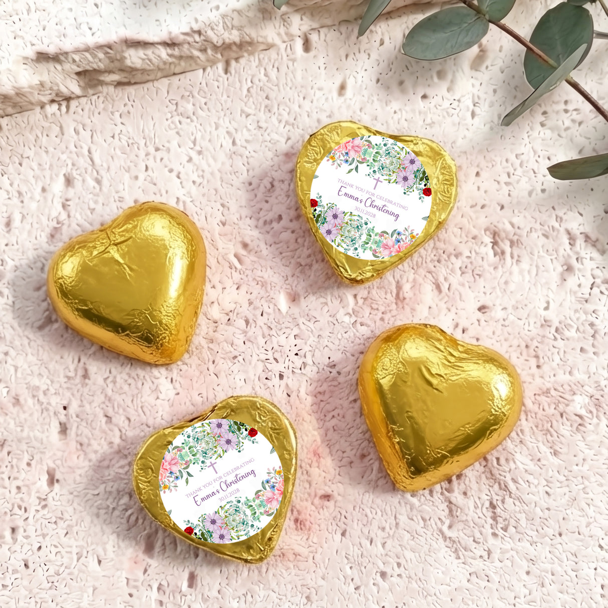 Personalised foil chocolate hearts set in gold with floral christening label