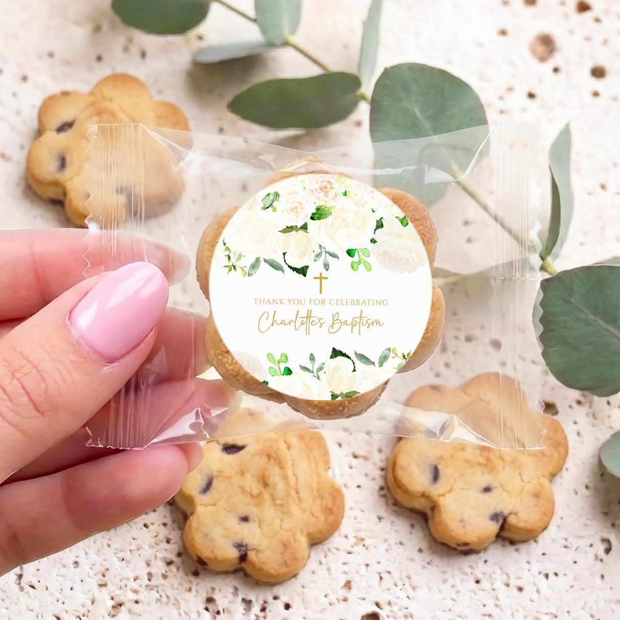 Personalised bite-size chocolate chip cookies with white round label and green leaf pattern