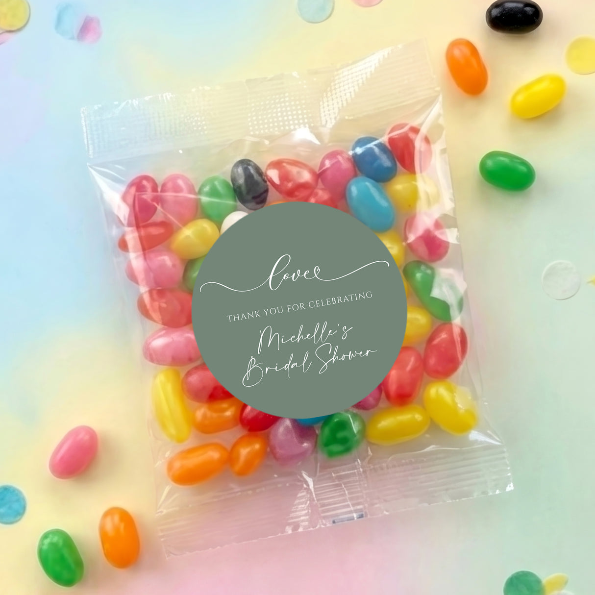 Clear jelly bean favor bag with colorful beans and sage green 'Love' round label