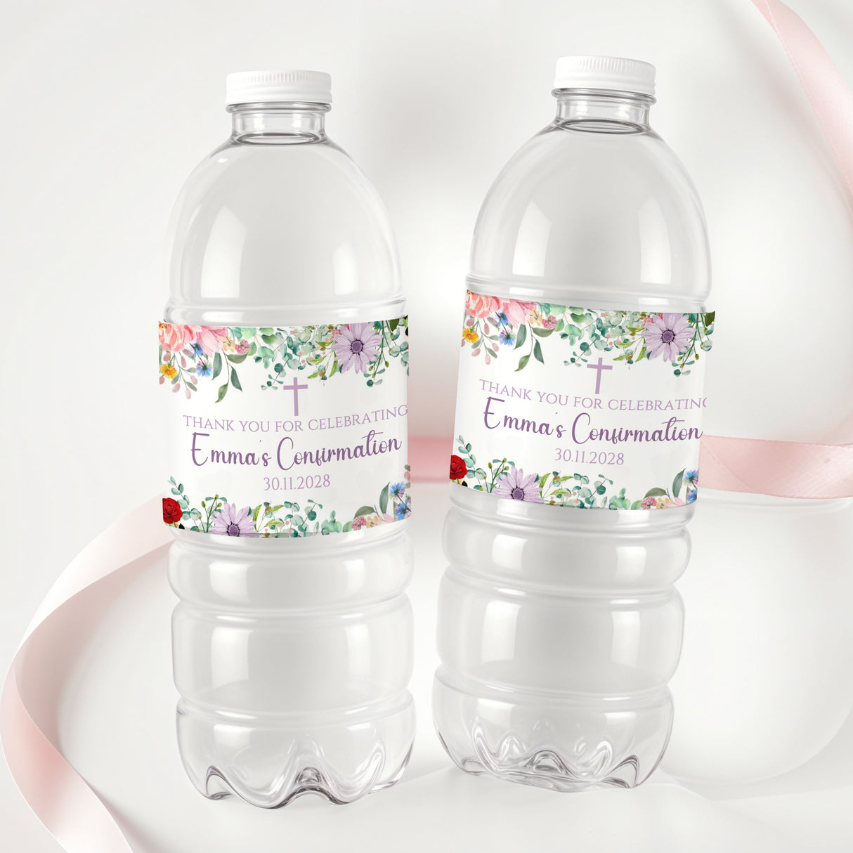 Printed bottle labels on two clear soda bottles with wildflower band and red accents
