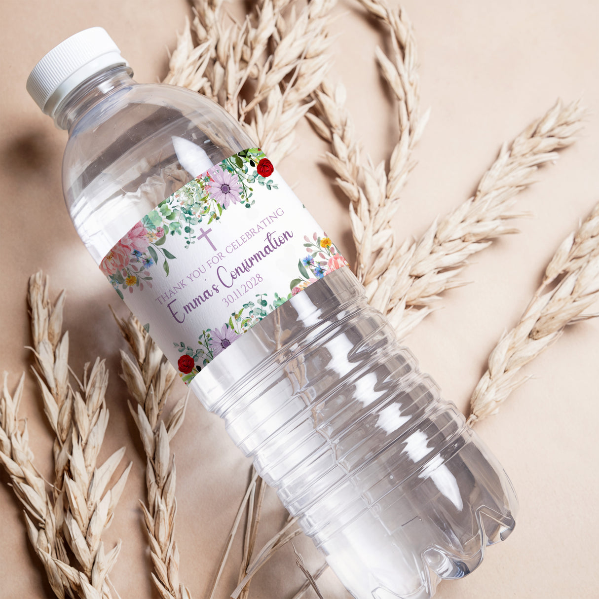 Printed bottle label with wildflower wreath, red flowers, and light text accents