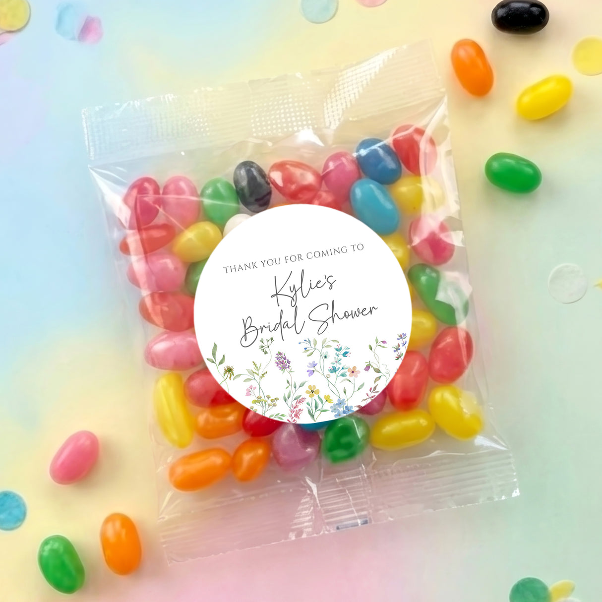 Personalised jelly bean favor bag with round thank-you sticker and colorful sweets