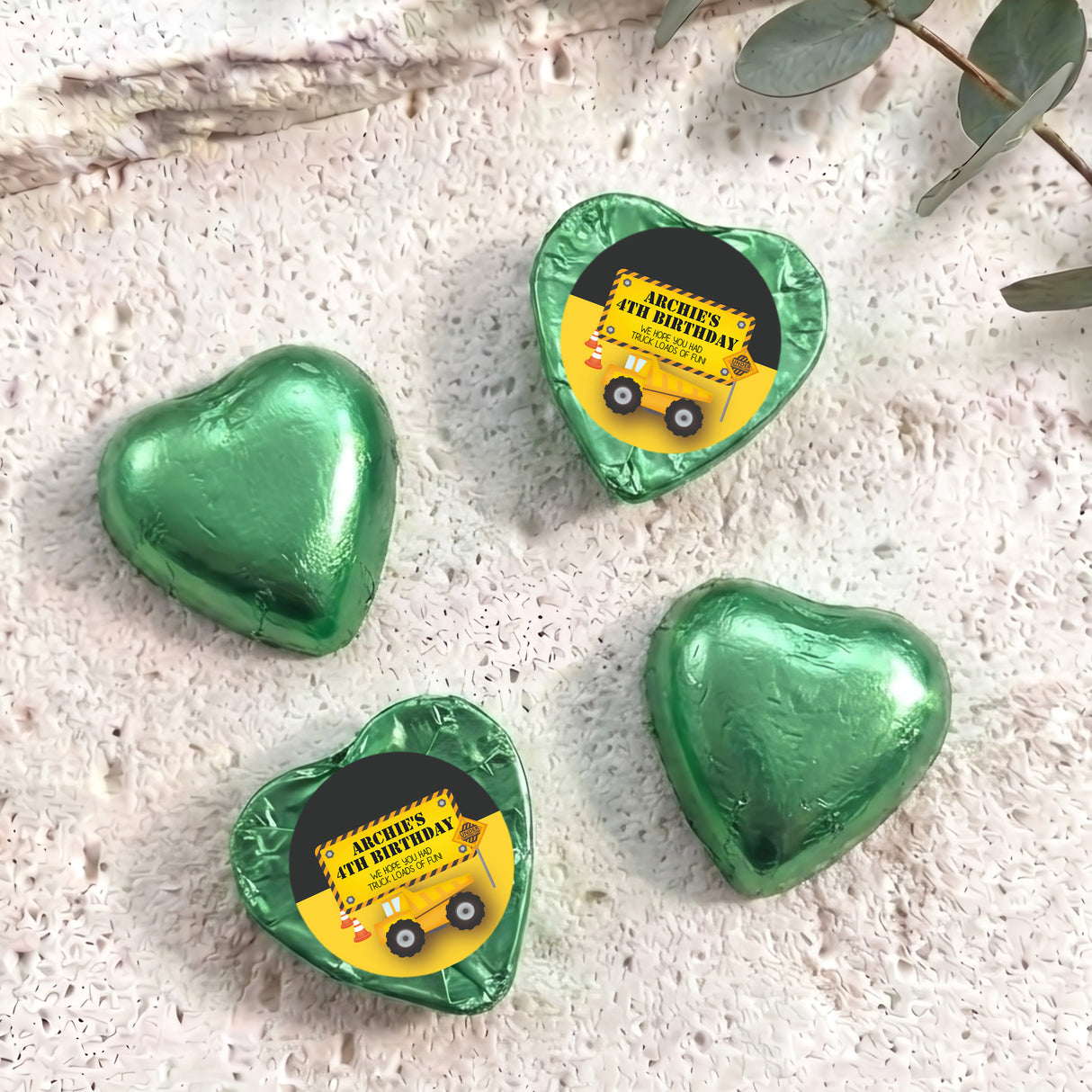 Green foil chocolate heart with 'Archie's 4th Birthday' label