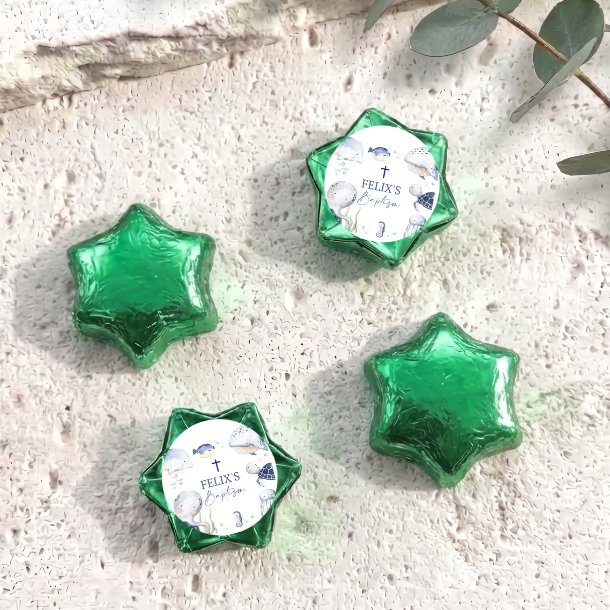 Foil-covered star chocolates with personalized label, green foil stars