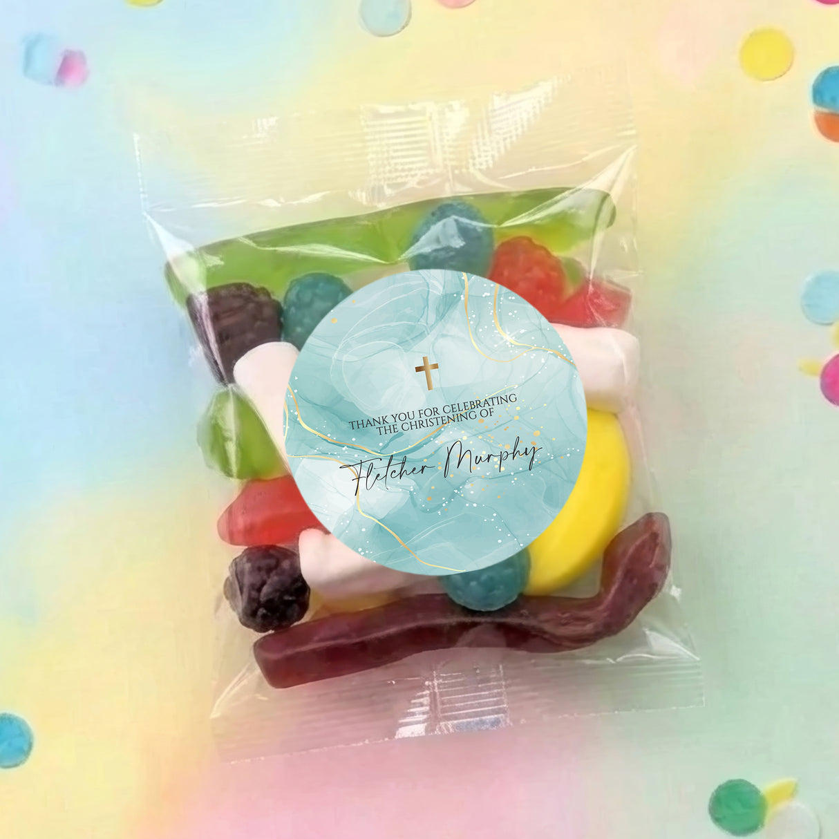 Green cross christening lolly bag with round personalised label and wrapped sweets