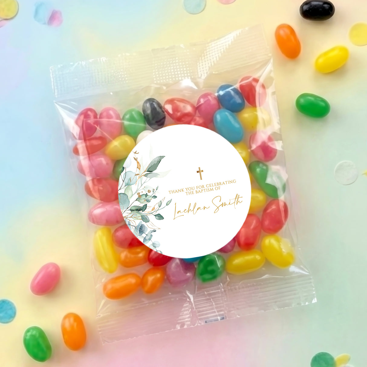 Personalised jelly bean bag with round baptism label and gold cross, assorted colorful candies