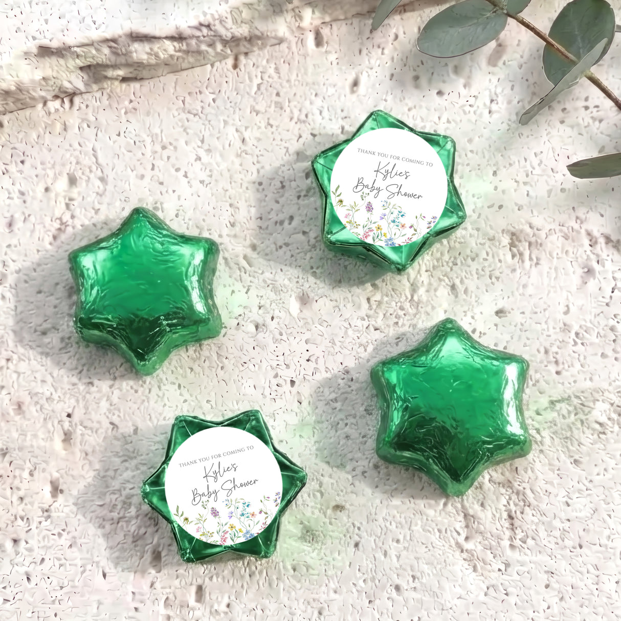 Personalised foil-covered chocolate stars, green star-shaped chocolates with printed thank-you tags