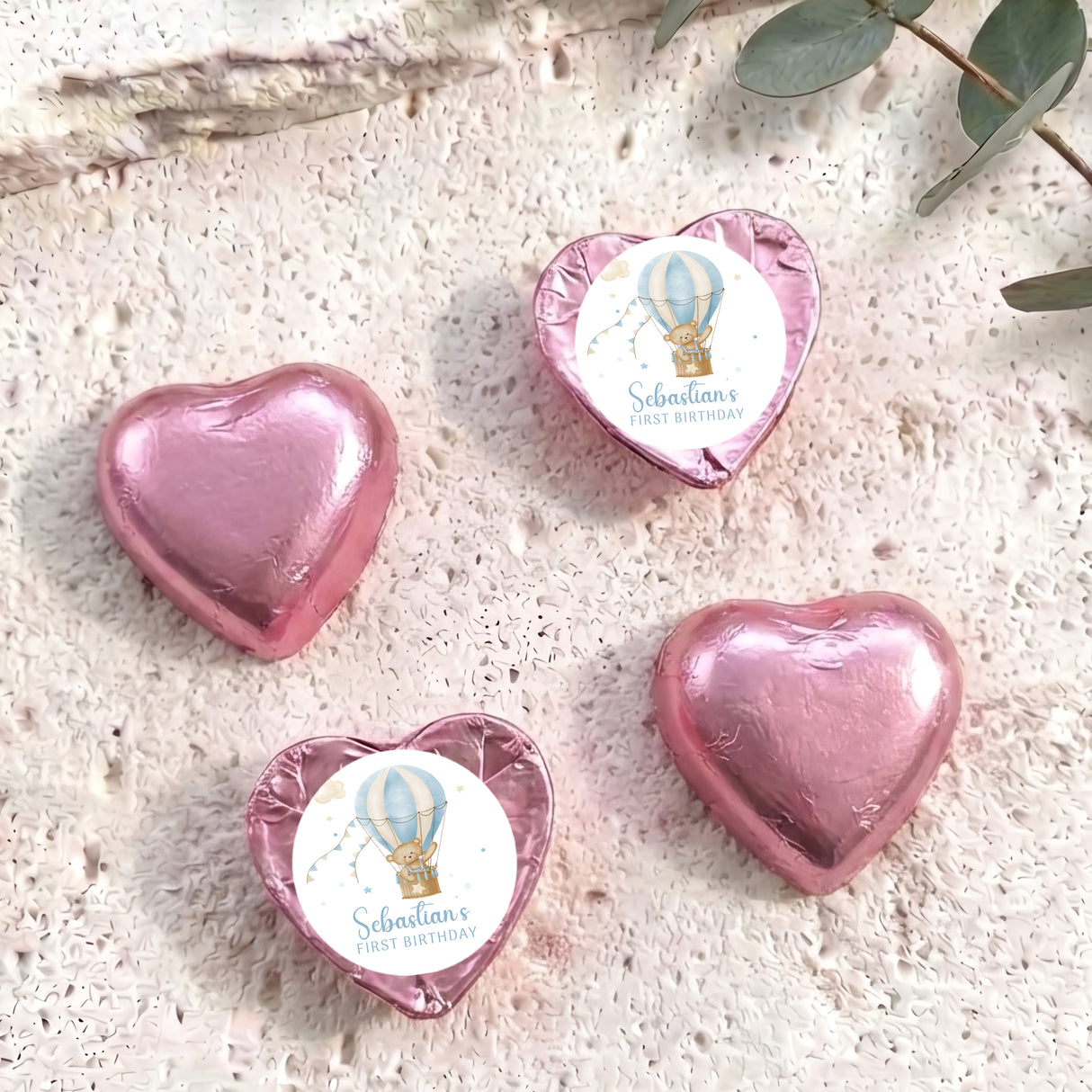Pink foil-covered heart chocolates with hot air balloon label, personalised